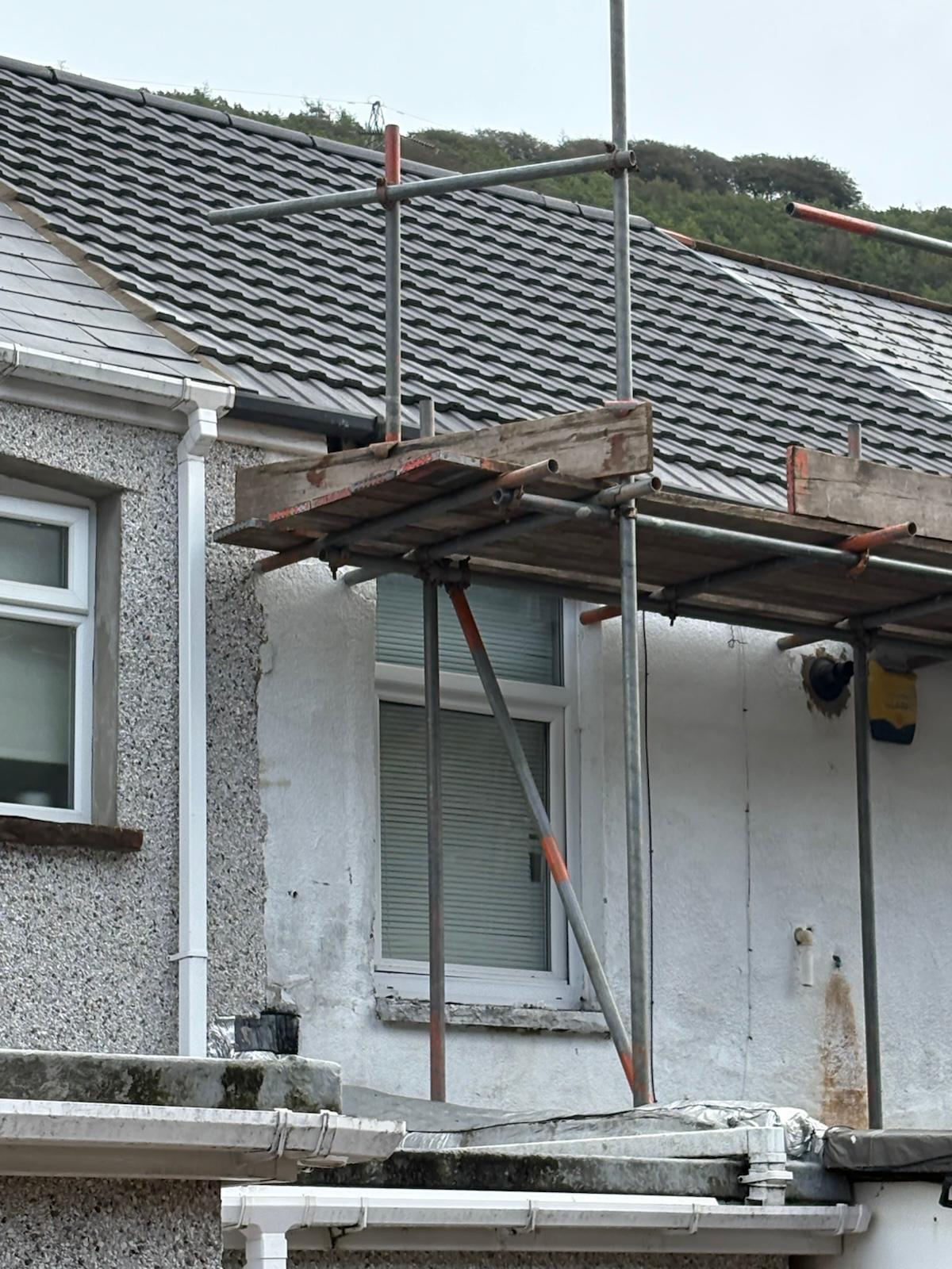 Completed slate to tile roof replacement with new grey interlocking tiles in Ebbw Vale